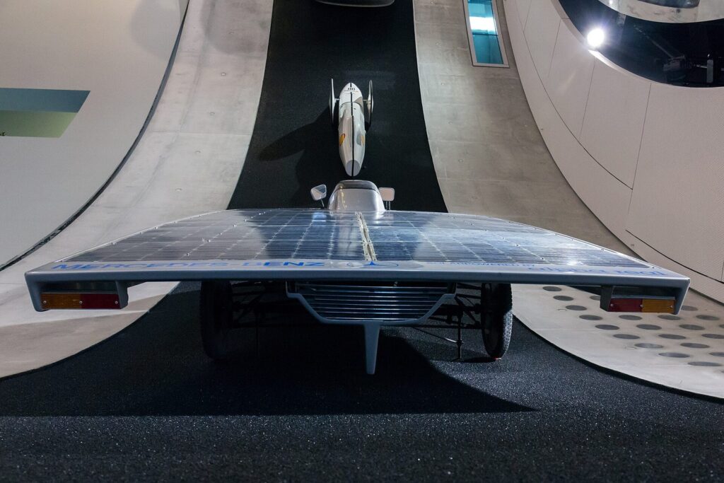 Seen from behind: the wide solar deck with lights and the Alpha Real lettering.