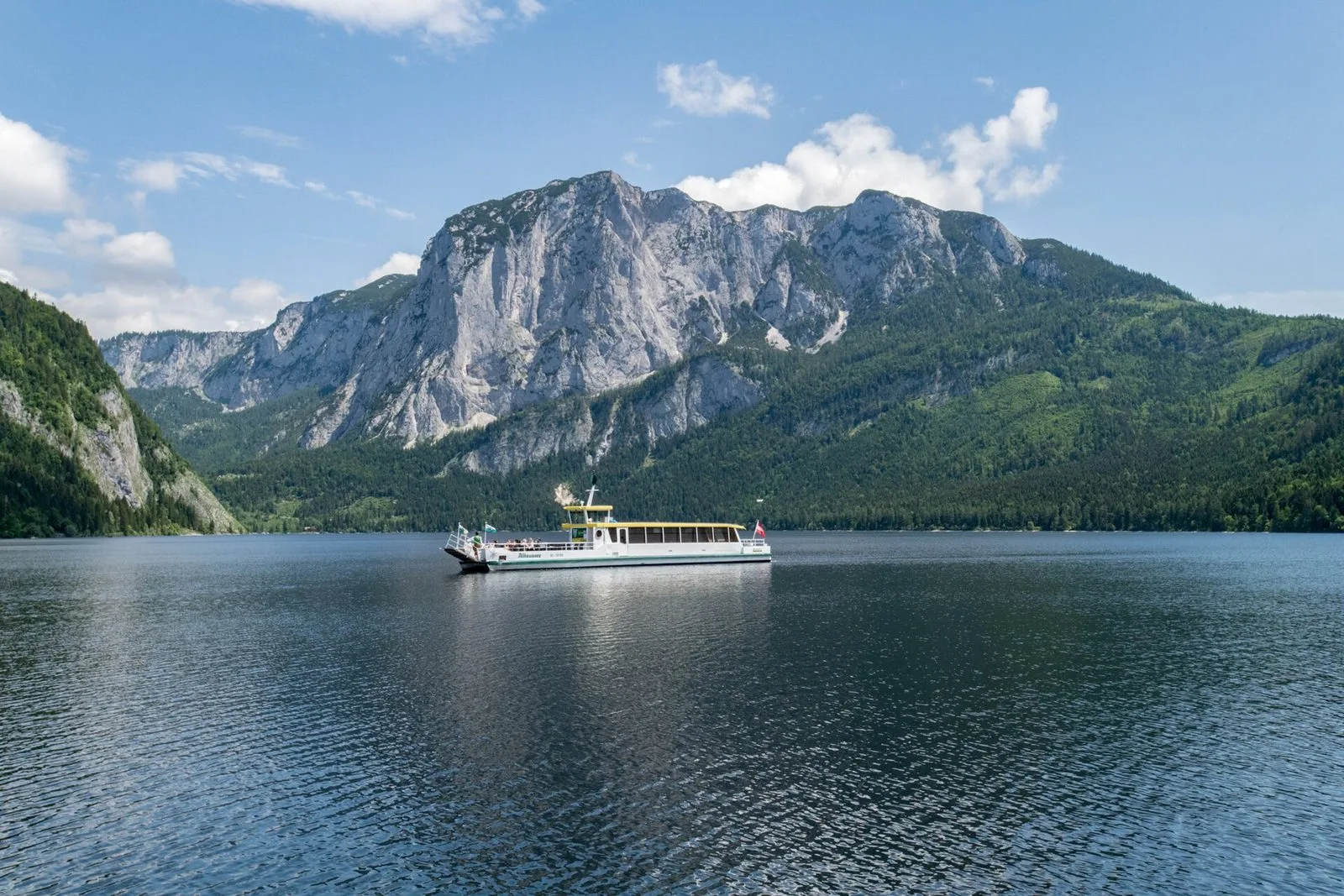 The solar ship Altaussee on the Altausseer See below the Trisselwand mountain
