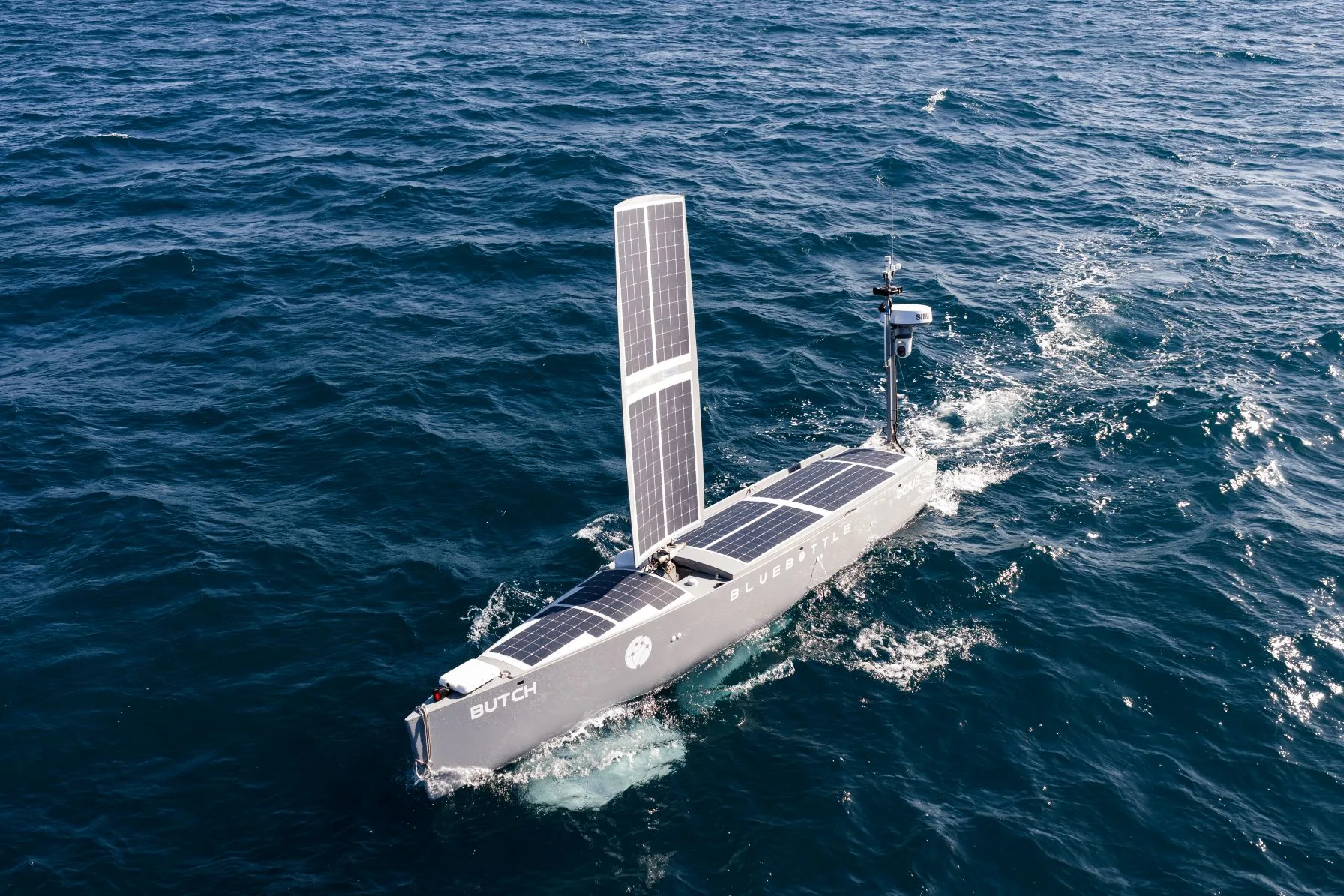 A Bluebottle uncrewed surface vessel with its upright solar sail at sea