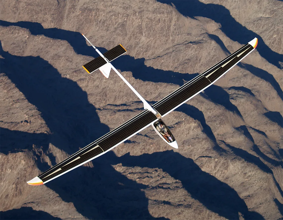The slender Sunseeker II solar aircraft flying over the Southern California desert