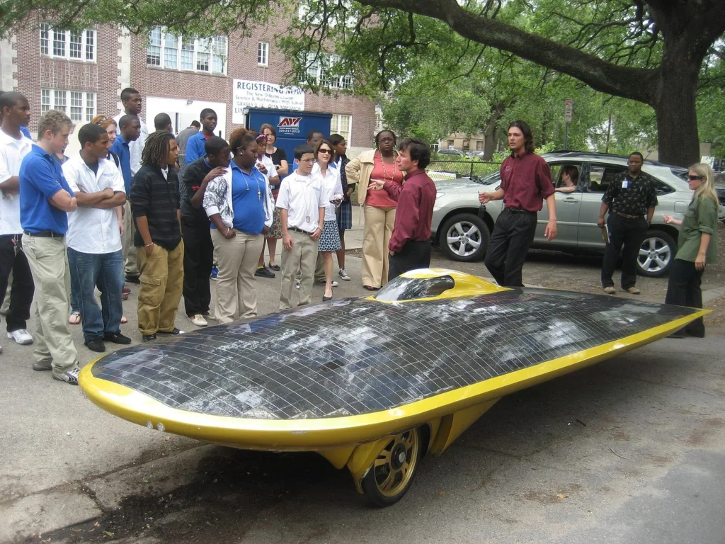 Marcelo da Luz and his solar car XOF1 visiting a school in New Orleans