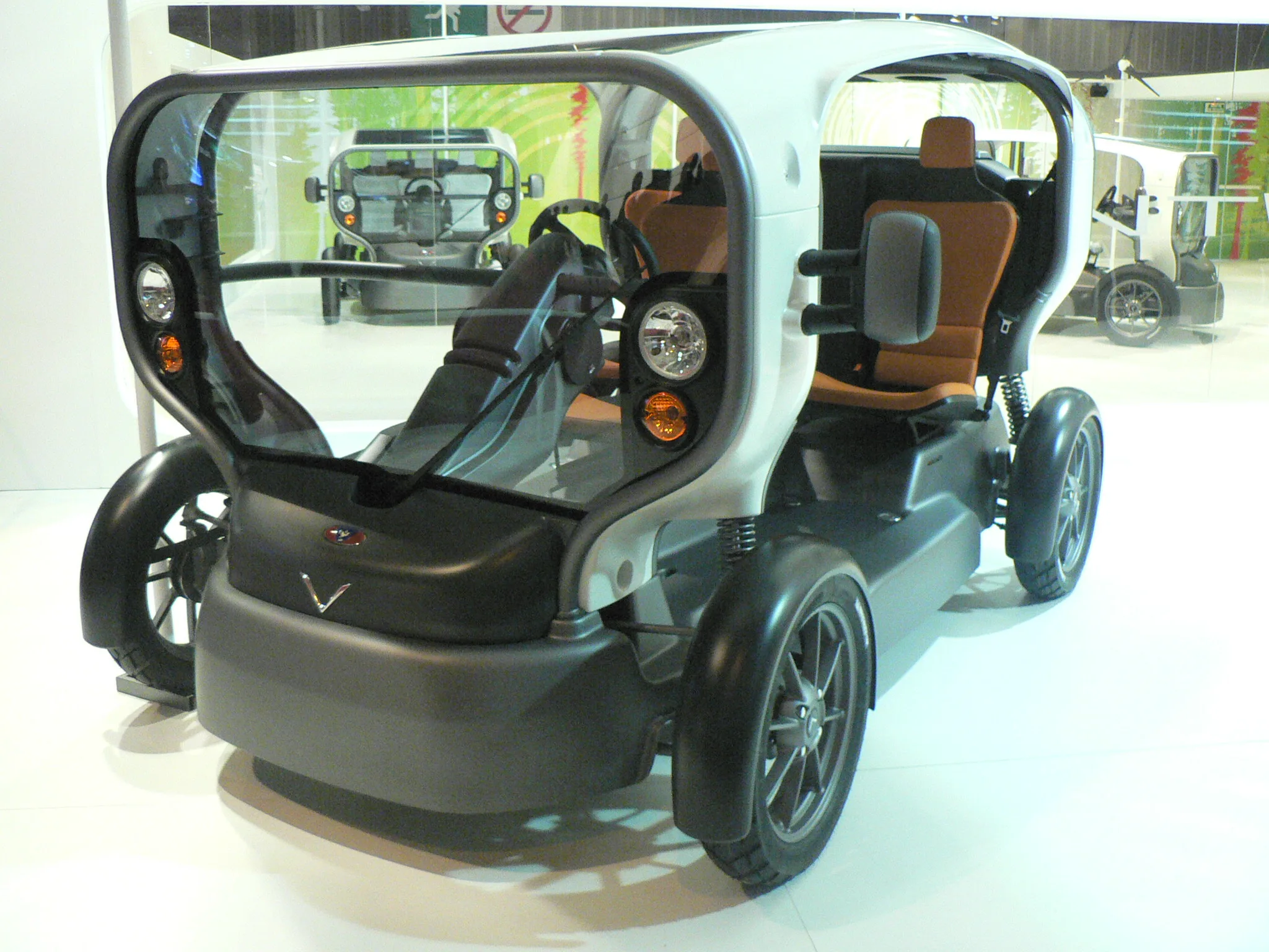 The open-sided Venturi Eclectic electric city car with a solar roof at the Paris motor show 2006